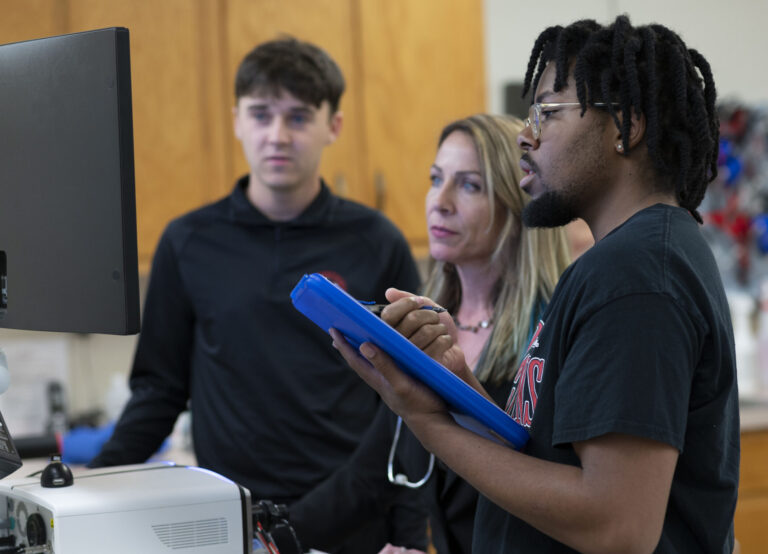 Master of Athletic Training YSU Student with Professor in class.